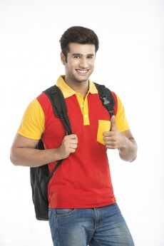 guy showing thumbs up with one hand and holding bag strap with other h