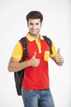 college boy showing thumbs up with both hands 