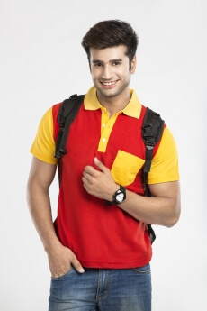 college boy posing with backpack