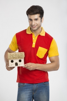 young guy posing with home miniature 