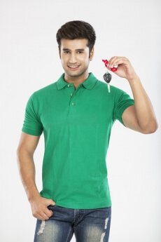 man showing car key while posing 
