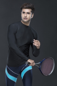 man posing while playing tennis