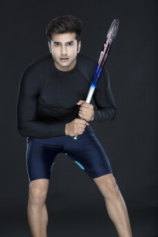 man in sports wear playing tennis 