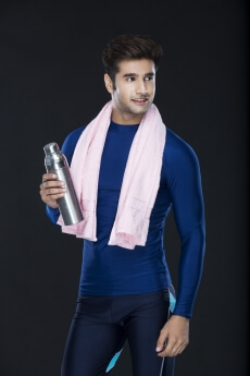 sports man posing with sipper in hand 