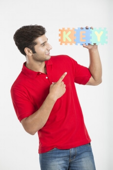 guy pointing at the letter key made from jigsaw puzzle 