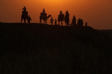 tourists taking camel ride