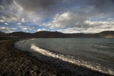 beautiful mountains covered with clouds along ladakh river 