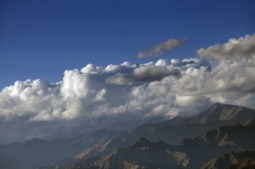 mountains with blue sky surrounded by clouds 