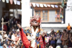 ladakhi in costume entertaining crowd of ladakh street