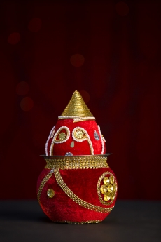 decorative kalash against red background 