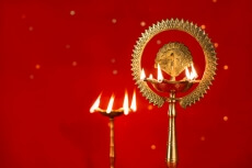 diya stands against red background
