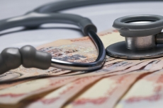 stethoscope and cash