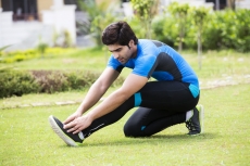 young man working out in park 