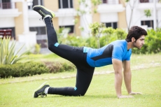 young man in park exercising 