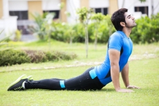 man doing exercise in park