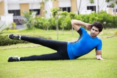 man exercising in garden 