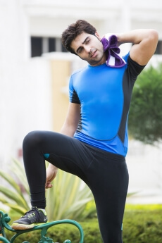 man wiping off his sweat after exercise 