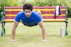man exercising in park 