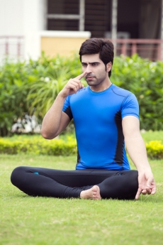 boy doing yoga in morning 