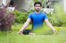 boy practicing yoga in morning 