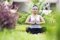 girl doing namaskara in park 