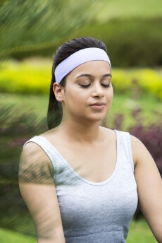 girl doing padmasana with eyes closed 