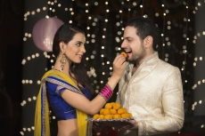wife feeding sweets to husband