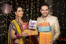 couple with diwali gifts  