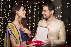man gifting wife a necklace 
