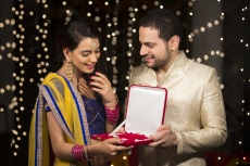 husband giving jewellery to wife