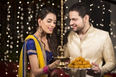 couple lighting lamp on diwali