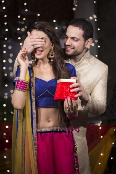 husband giving a surprise gift to his wife