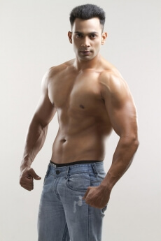 portrait of a muscular man in a blue denim