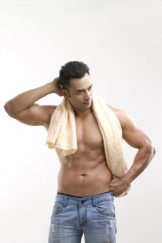 man posing with a towel
