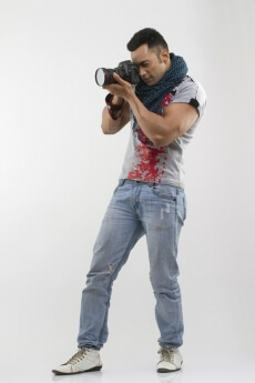 portrait of a well-built man taking pictures
