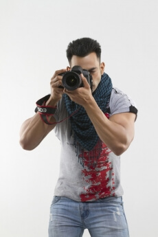portrait of a well-built man taking pictures