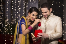 husband giving surprise to wife