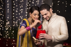 husband giving surprise to wife