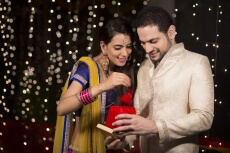husband giving surprise to wife