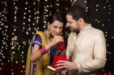 husband giving surprise to wife
