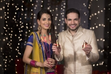 couple with crackers on diwali 