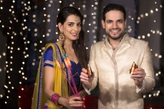 couple with crackers on diwali 