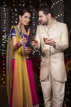 couple with crackers on diwali 