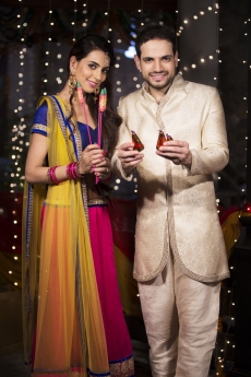 couple with crackers on diwali 