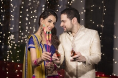 couple with crackers on diwali 