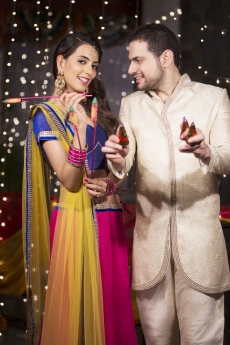 couple with crackers on diwali 