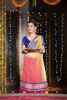 woman in traditional wear holding pooja thali
