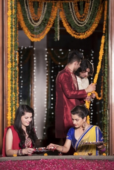 couples decorating home on diwali 