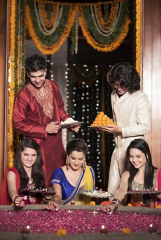 couples decorating home on diwali 