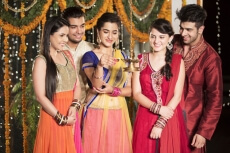 couples lighting diya on diwali